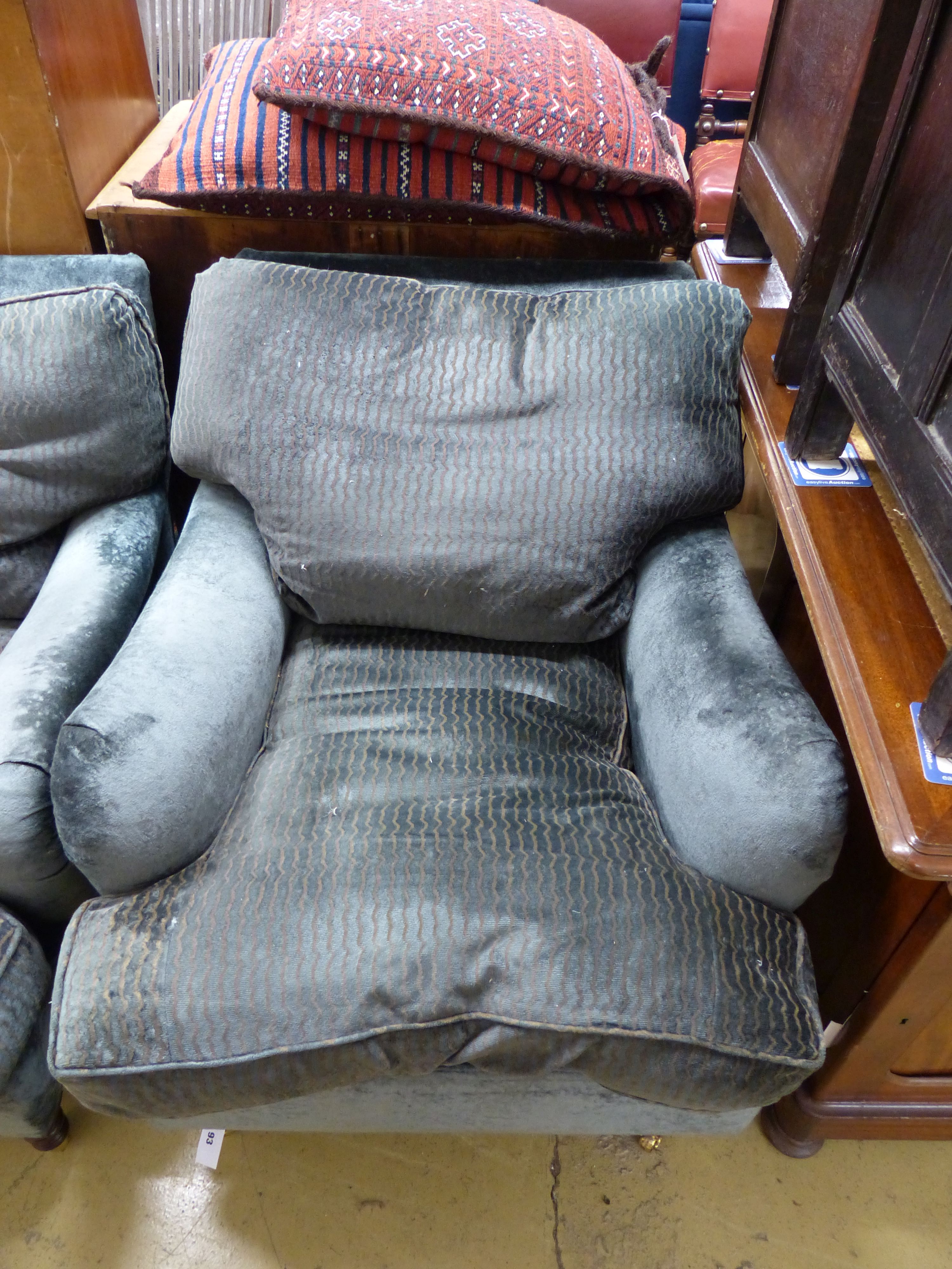 Two George Smith club armchairs in matching upholstery